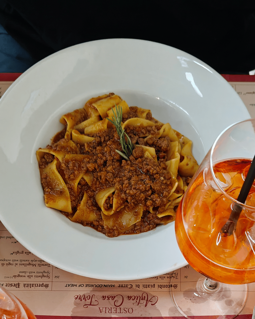 a famous Tuscan pasta dish featuring wide, flat egg ribbons (pappardelle) tossed in a rich, slow-simmered wild boar (cinghiale) ragù
